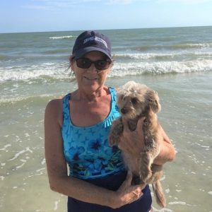 Sally Goodale and her dog at the beach